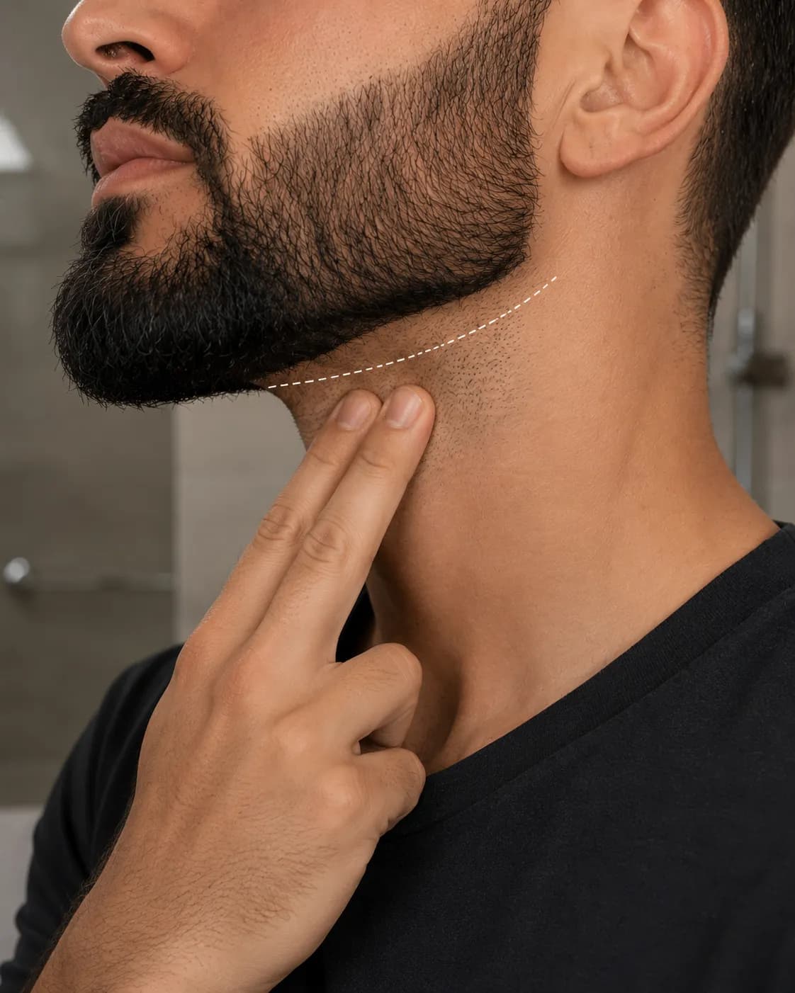 Close-up side view of a beard neckline with a dotted U-shaped guide positioned about two fingers above the Adam's apple, showing the correct trimming line for a clean, defined beard neckline.